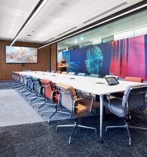 A large meeting room with a video wall, furnished by JPA Workspaces