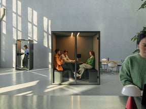 Acoustic focus pods in a bright open plan workspace