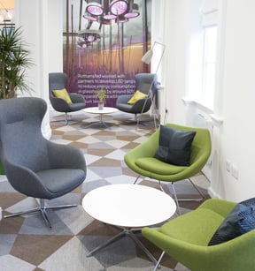 Lounge seating with grey and green armchairs at Rothamsted Enterprises in Harpenden, furnished by JPA Workspaces