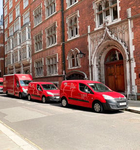 JPA Workspaces service vans parked on a London street