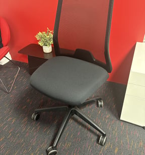 A refurbished task chair with a new seat cover